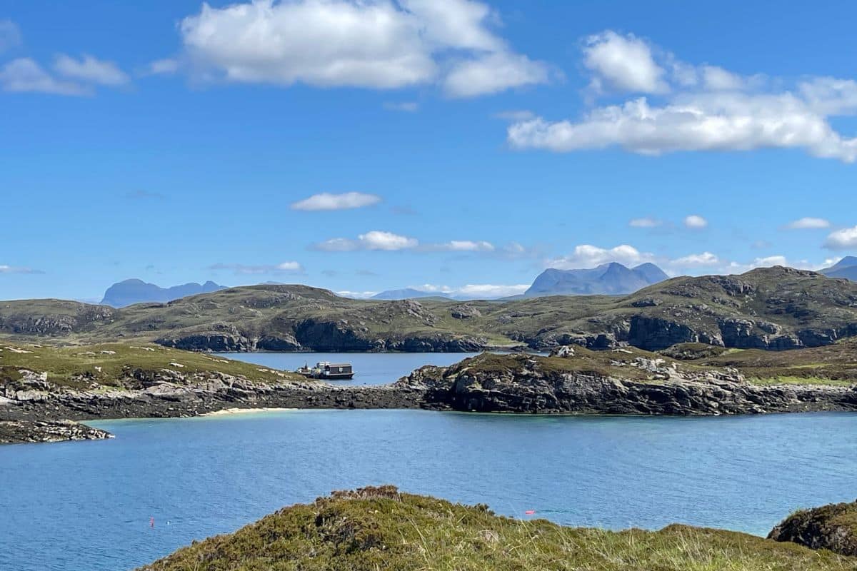 Wester Ross Marine Protected Area - Water and land islets under blue sky
