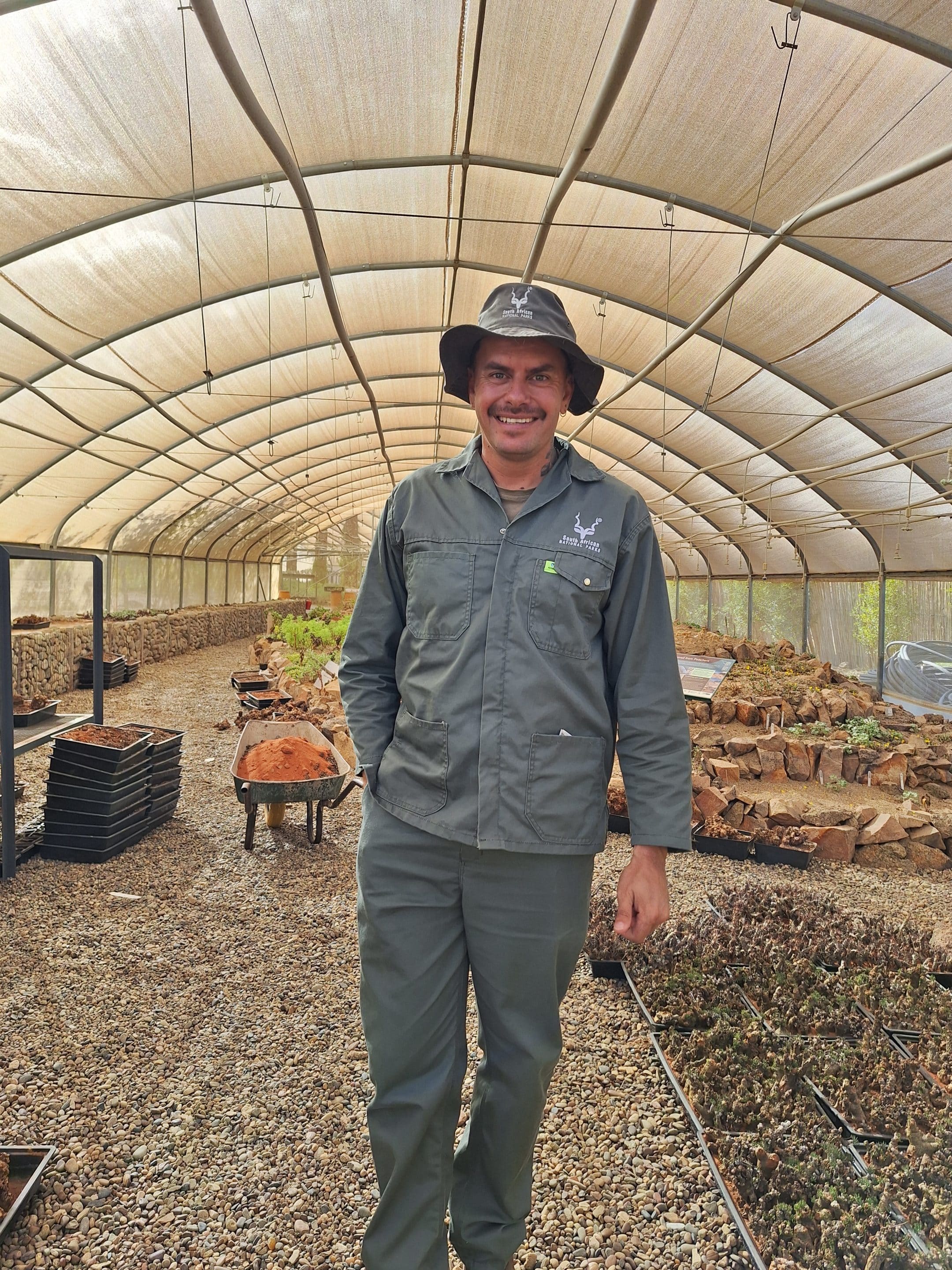 Botanist in greenhouse