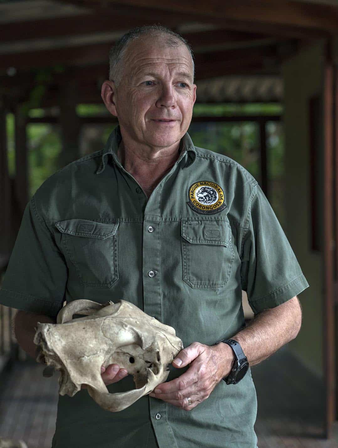 Marc Stalmans holding a lion skull. Credits: Gorongosa