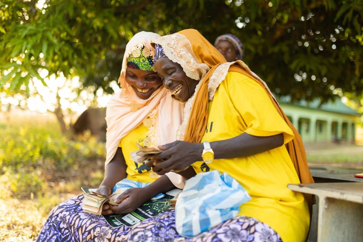 Women laughing at the saving and loans group
