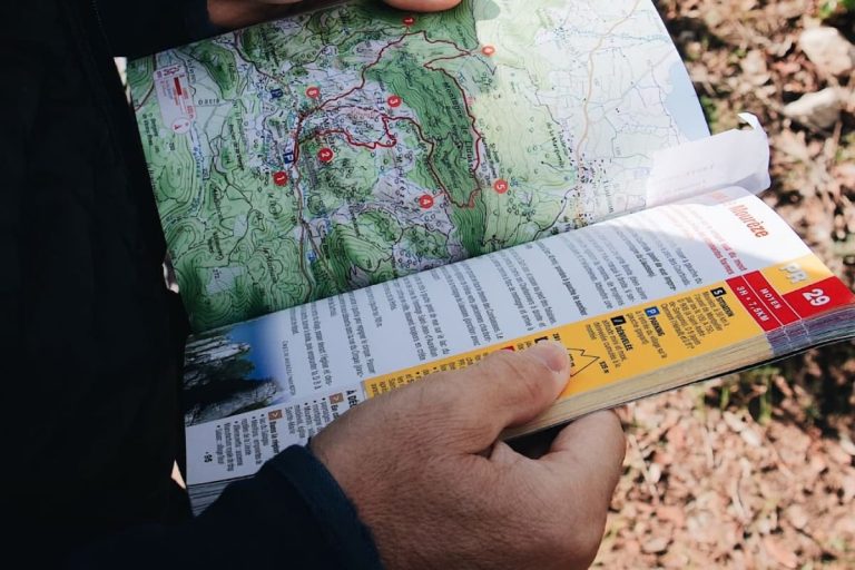 close up of man reading a map guide